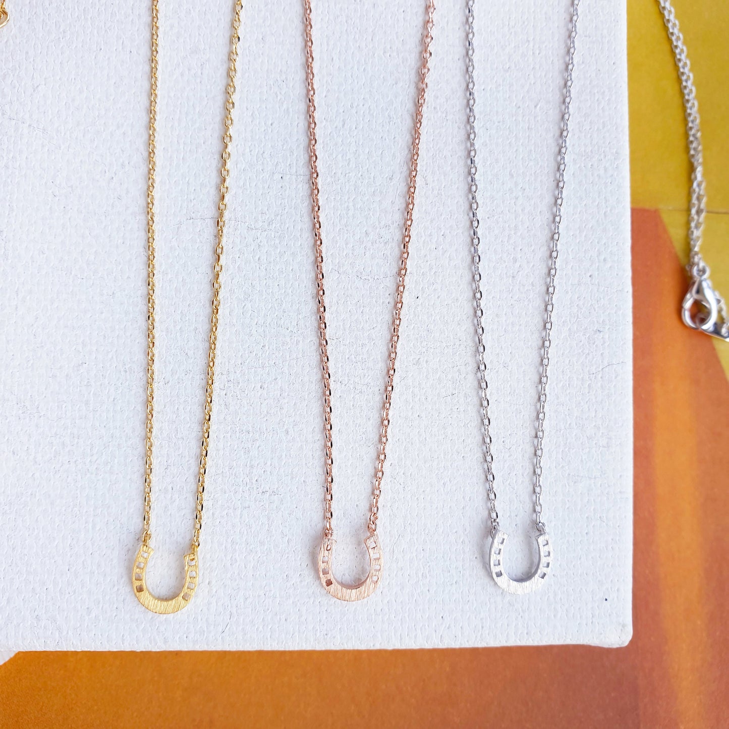 Horseshoe Tiny 4 Punch Pendant Necklace
