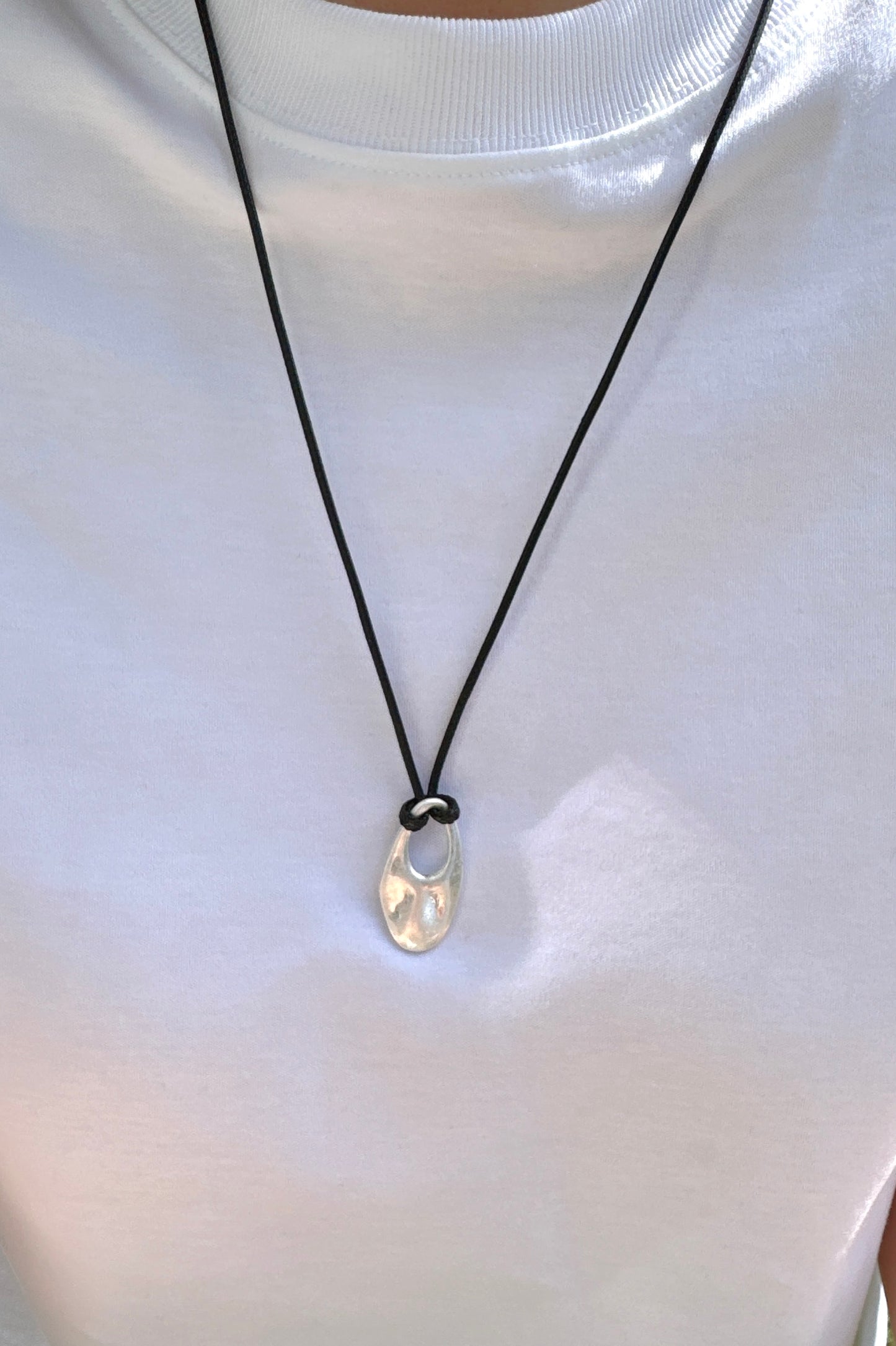 Cord Necklace with Oval Cut Out Pendant