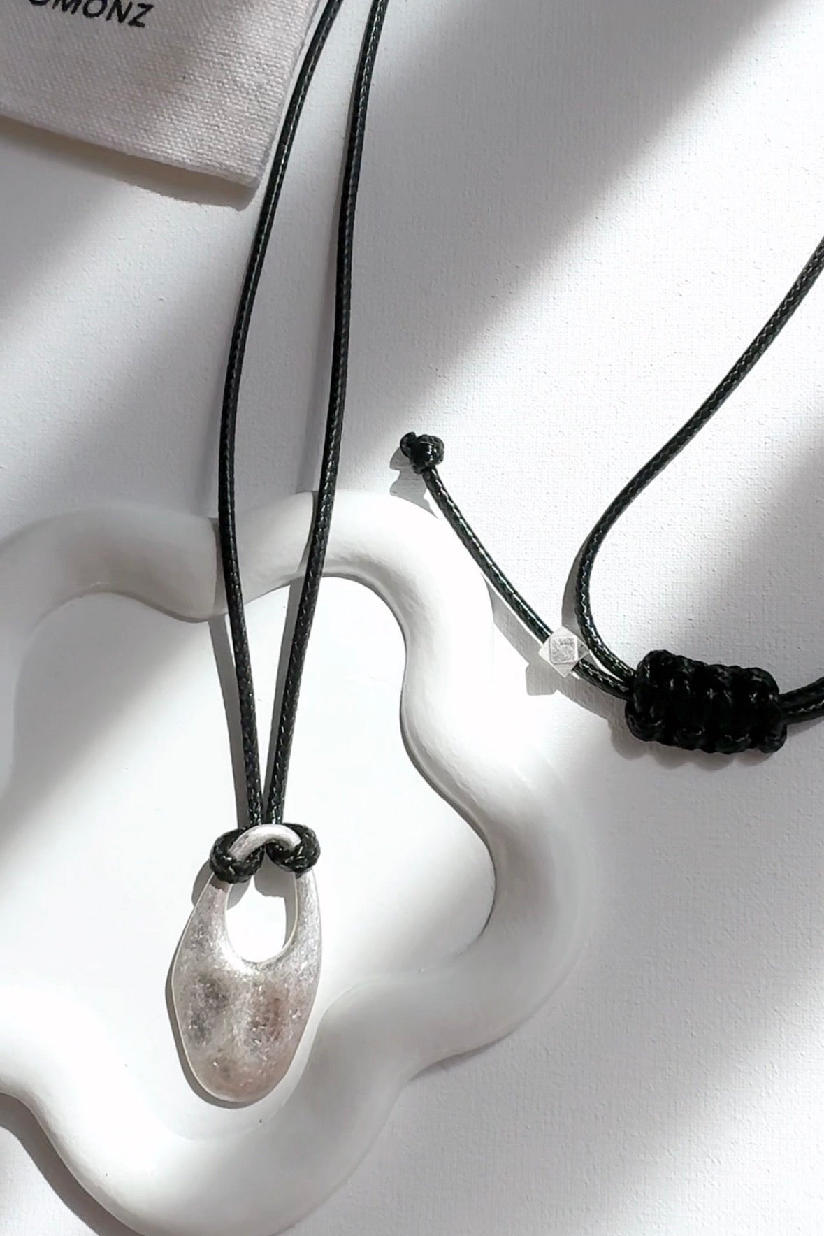 Cord Necklace with Oval Cut Out Pendant