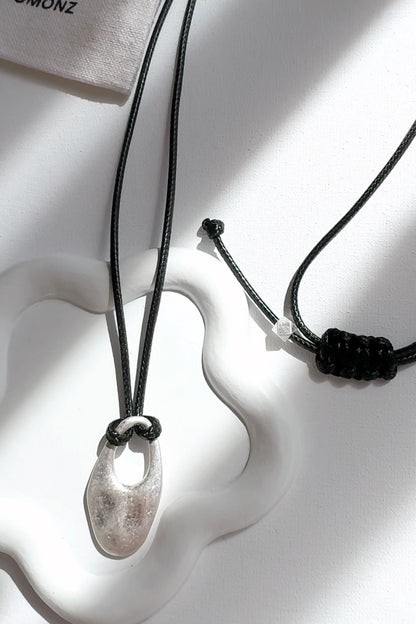 Cord Necklace with Oval Cut Out Pendant