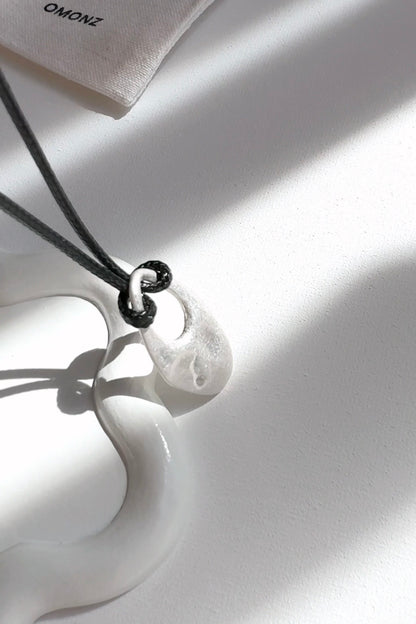 Cord Necklace with Oval Cut Out Pendant