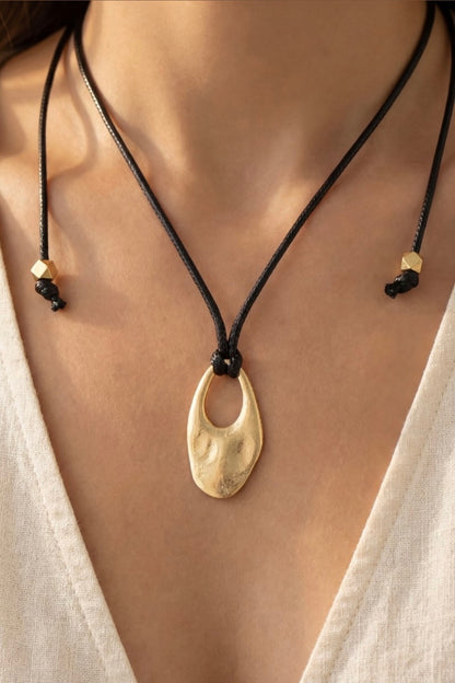 Cord Necklace with Oval Cut Out Pendant